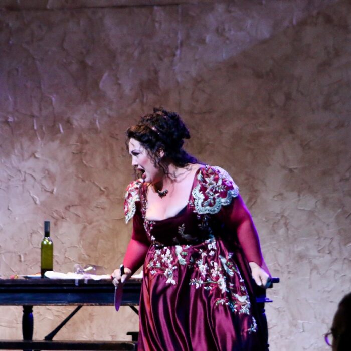 An opera scene from Tosca featuring Toni Marie Palmertree as Tosca